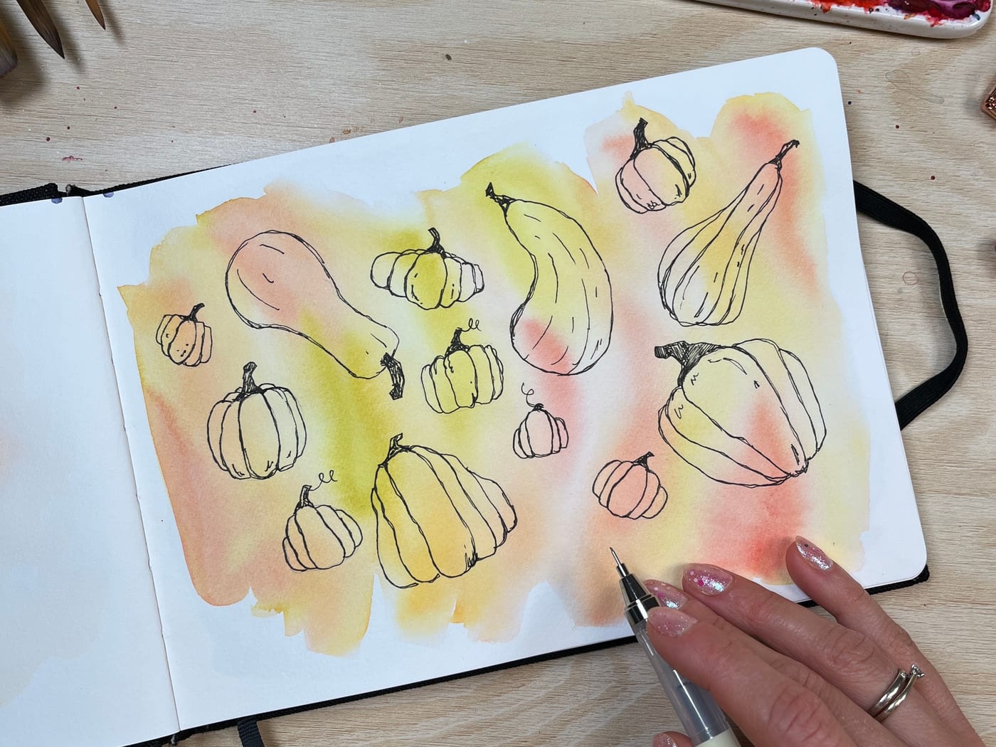 Ink sketches of pumpkins and gourds on a warm autumn wash